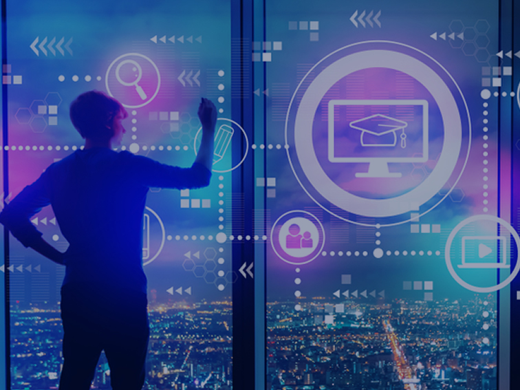 Person interacting with virtual interface displayed over a full height window with city nightscape in background