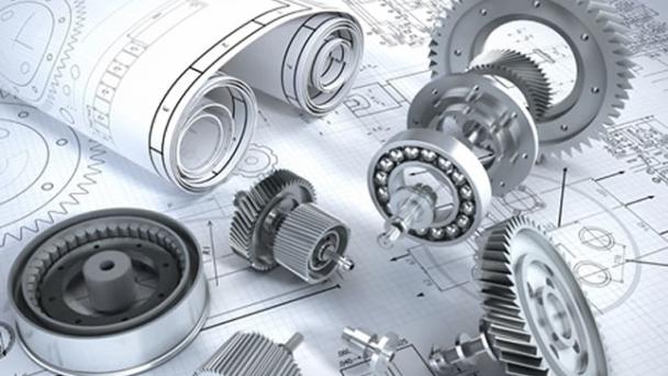 Loose gears and cogs scattered on engineering blueprints