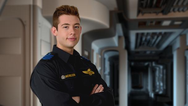 Petty officer standing in starship corridor