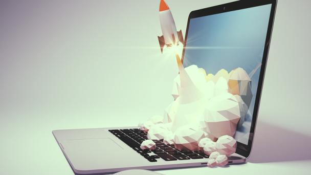 Model of rocket launching from open laptop