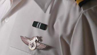 Dress uniform closeup of badge and ribbon