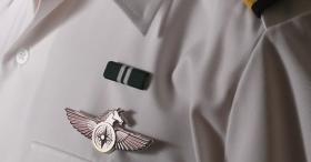 Dress uniform closeup of badge and ribbon